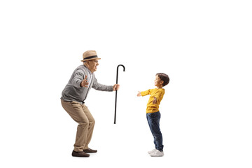 Wall Mural - Boy meeting an elderly man with arms wide open