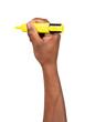 Man holding a yellow highlighter in a hand and highlighting, writing or drawing, isolated on white or transparent background