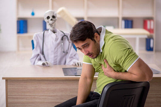 Young male patient visiting skeleton doctor