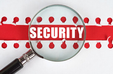 Poster - Between two sheets from a notebook on a red stripe with the inscription - security, there is a magnifying glass