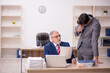© Elnur - Two male colleagues sitting in the office