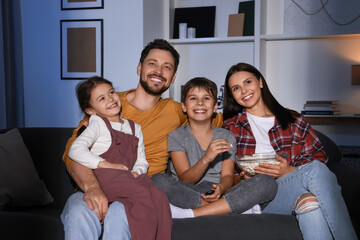 Poster - Happy family watching TV at home in evening