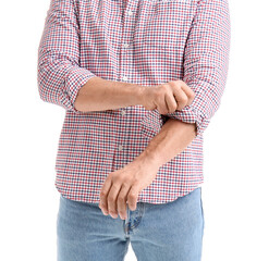 Wall Mural - Mature man rolling up his sleeve on white background, closeup