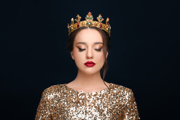 Wall Mural - Beautiful young woman wearing luxurious crown on black background