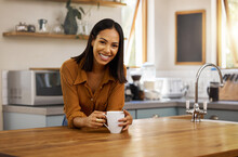 Happy portrait, coffee and woman at house in a kitchen with a hot drink feeling relax and calm in the morning. Happiness, zen and young female smile in a home with a mug in a household with tea