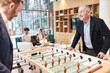 © Robert Kneschke - Two business people at the foosball table playing table football