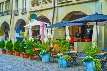 Canvas Print - The scenic outdoor dining of the local restaurant on Kramgasse street in Bern, Switzerland