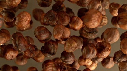 Poster - Super slow motion of rotating hazelnuts up to the air. Filmed on high speed cinema camera, 1000fps, placed on high speed cine bot.