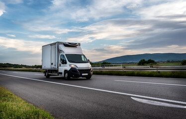 White cargo van at the interurban road