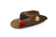 Anzac Day army slouch hat with red poppy isolated on white background.