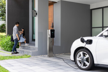 Sticker - Progressive father and daughter plugs EV charger from home charging station to electric vehicle. Future eco-friendly car with EV cars powered by renewable source of clean energy.