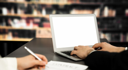 Poster - Empty laptop computer screen for astute design mockup on a table in library of university