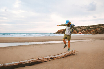 Wall Mural - man traveler walking alone on the beach travel lifestyle active summer vacations outdoor sea view