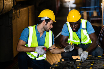 Wall Mural - Engineers examine the safety of batteries in industrial plants. Workers in manufacturing plants. professional engineer.