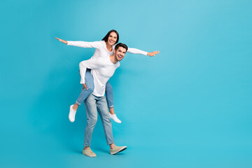 Aufkleber - Full size photo of two excited crazy partners hold piggyback arms wings empty space isolated on blue color background