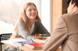 © Pixel-Shot - Teenage girl sitting with her boyfriend in classroom