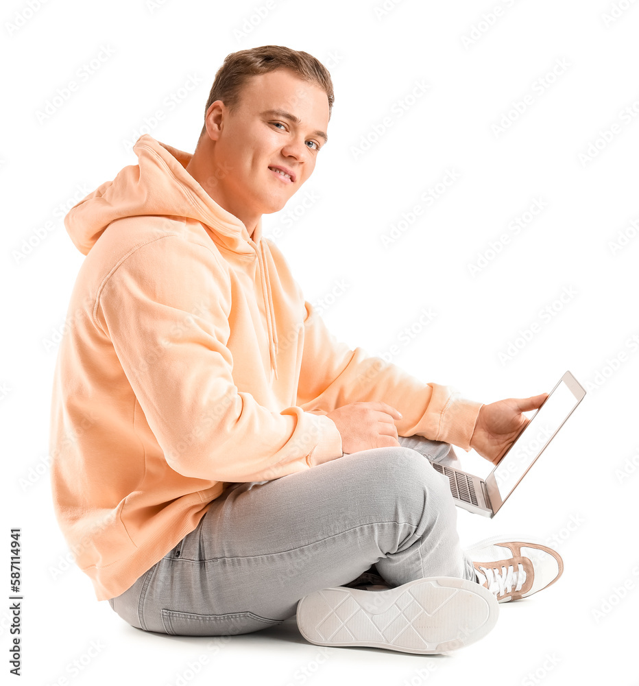 Young guy using laptop on white background