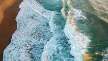Drone View Sandy Beach With Stunning Stormy Ocean At Soft Sunset Sunlight.