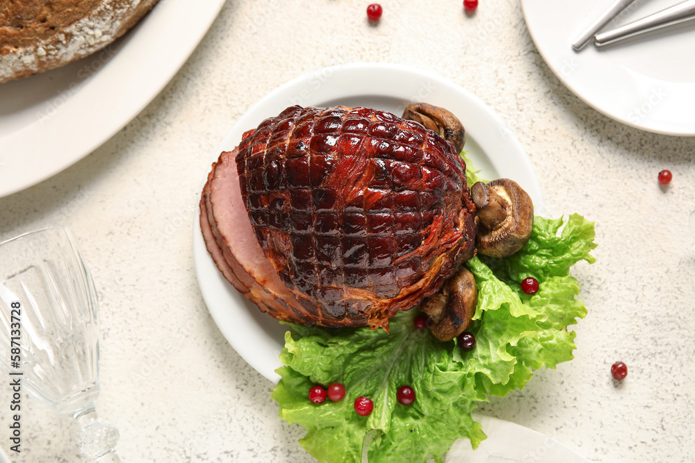 Plate with tasty smoked ham and grilled mushrooms on light background