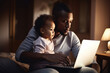 © Gary - Young black man working on laptop with child on his lap by generative AI