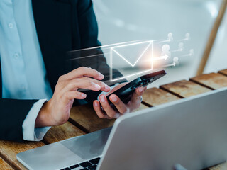 Poster - Sending Email, send message and business teamwork concepts. Fast moving of digital letters symbol with many person icons appearing while business person using phone and working with laptop computer.