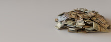 Stack Of Cash Bundles. Banking Banner With Mixed Denomination Bills And Copy-space.
