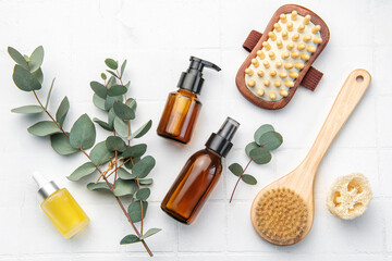 Spa treatment concept. natural spa cosmetics products with eucalyptus oil,, massage brush, eucalyptus leaf.