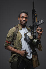 Portrait of african man pirate in setting of post apocalypse looking at camera.