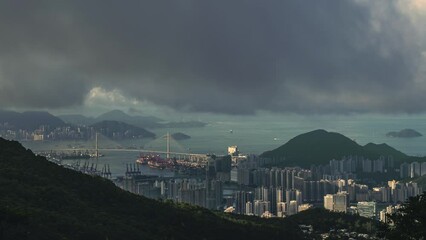 Canvas Print - Time lapse shot of Cityview buildings and fast boats moving in the water under fast-moving clouds