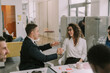 © qunica.com - Young handsome male person flirting with his beautiful female colleague at work