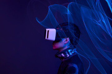 Wall Mural - Man is using virtual reality headset to access in metaverse.