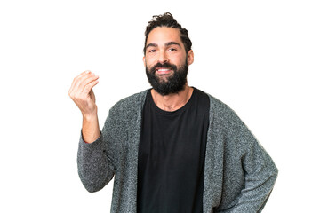 Wall Mural - Young man with beard over isolated chroma key background making Italian gesture