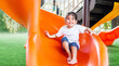 © Yanukit - happy asian kids playing slide outdoor play park for little children exercise and recreation for strong healthy
