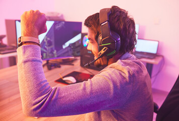 Aufkleber - Winner, fist and man on computer with microphone, celebrating game win and success. Happy male gamer, cheering or esport player celebration for online competition, excited for progress or achievement