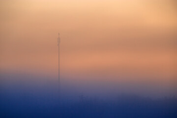 Wall Mural - Silhouette of old electrical lines, old telephone cables and light at the golden hour on the sunrise.