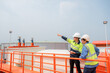 © เลิศลักษณ์ ทิพชัย - 2 Asian male industrial engineers and architects Work to inspect water systems and water tank systems in engineering plants, public utilities, drains and industrial wastewater treatment plants.