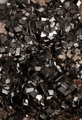  Black andradite garnet mineralogy material crystals. Andradite garnet mineralogy material crystals.  Close up of sample of natural mineral from geological collection Selective focus