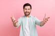 © deagreez - Photo of young man funny ceo manager friendly welcome you wear trendy clothes hello people welcome isolated on pink color background