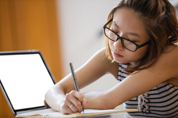 Young woman studying in classroom