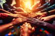 © Real - A group of young business people coming together with a common goal, putting their hands together in solidarity