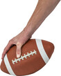 Cropped image of American football player placing the ball