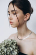 © Ananass - Stylish portrait of a young girl with gypsophila flowers and natural light, natural girlish beauty without makeup, minimalism and sophistication.