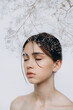 © Ananass - Stylish portrait of a young girl with gypsophila flowers and natural light, natural girlish beauty without makeup, minimalism and sophistication.
