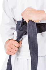 Poster - Fighter tightening karate belt