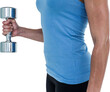 Muscular woman exercising with dumbbells 
