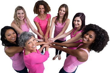 Wall Mural - Women in pink outfits joining in a circle for breast cancer awareness