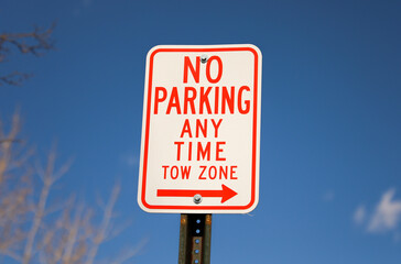 Wall Mural - No parking signs symbolize restricted parking zones to ensure safety, access, or traffic flow. They communicate that vehicles must not stop, stand, or park in the designated area.