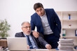 © Elnur - Two male colleagues working in the office