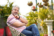 © Niks Ads - Indian senior man siting at his home garden.