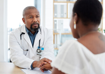 Sticker - Serious doctor, patient and holding hands in consultation for bad news, cancer diagnosis or comfort. Healthcare, black man and medical professional with woman for help, support and empathy in clinic.